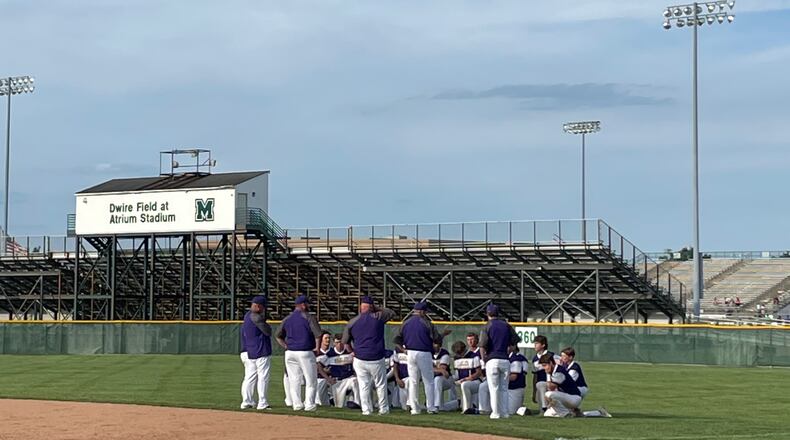 Eaton huddles after a loss in the Division II regional semifinals on Thursday, June 2, 2022, at Mason. Photo by Benjamin Conroy