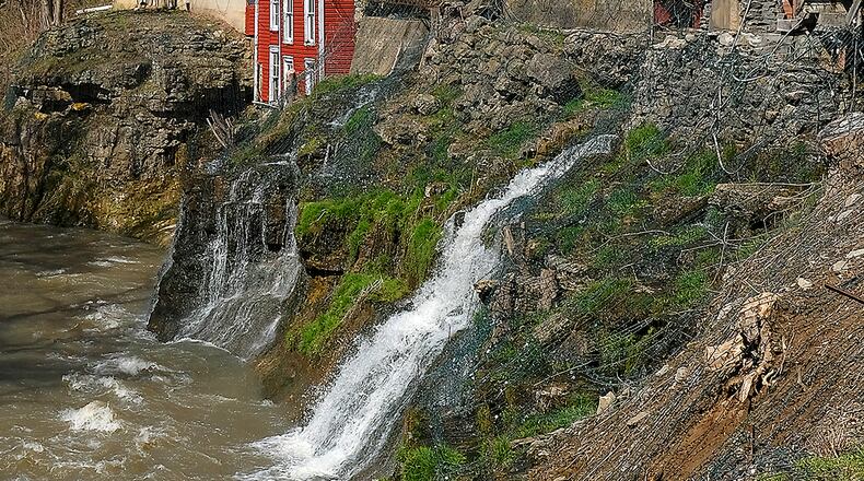 The village of Clifton, home to historic Clifton Mill, will host the Ohio Chautauqua showing the water falls and a different shot with an old gas station. BILL LACKEY/STAFF