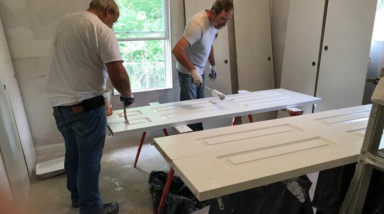 Two volunteers recently worked on a current Clark County Fuller Center for Housing remodeling project, which when finished will make a homeowner out of a single mother of three. CONTRIBUTED