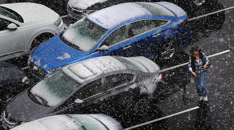 Rain and snow showers most of Monday April 18, 2022 in the Dayton area. MARSHALL GORBY\STAFF