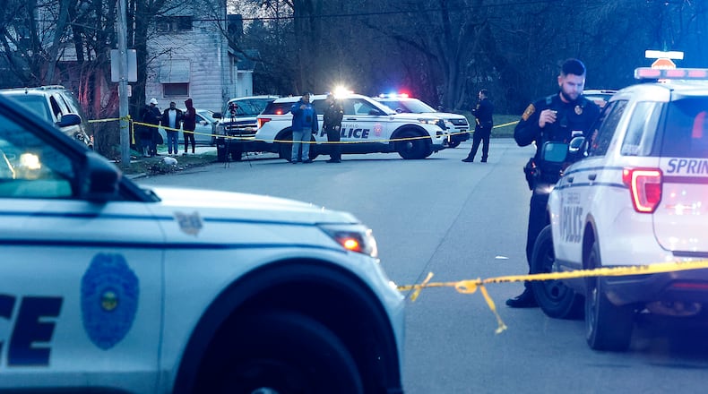The Springfield Police Division investigates the scene of a shooting along the 600 block of Euclid Avenue Thursday evening, Dec. 21, 2023. According to police they arrived to find a male laying beside the road with a gunshot wound to the head. The victim was transported to Springfield Regional Medical Center and flown by CareFlight to Miami Valley Hospital. BILL LACKEY/STAFF