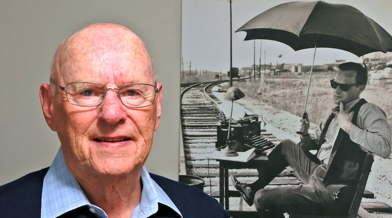 Dick Hatfield stands in front of a picture of himself from the 1960's at his home Wednesday, May 24, 2023. BILL LACKEY/STAFF