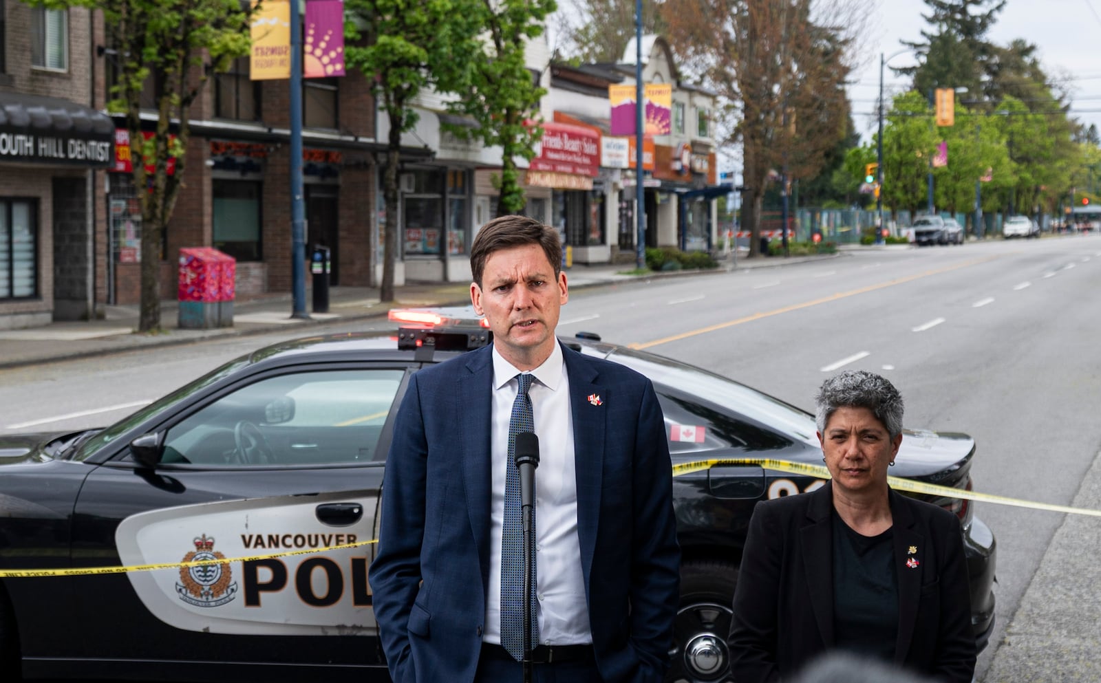 British Columbia Premier David Eby, left, delivers remarks after a vehicle drove into crowd during a Lapu Lapu Day festival in Vancouver, British Columbia, Sunday, April 27, 2025. (Rich Lam/The Canadian Press via AP)