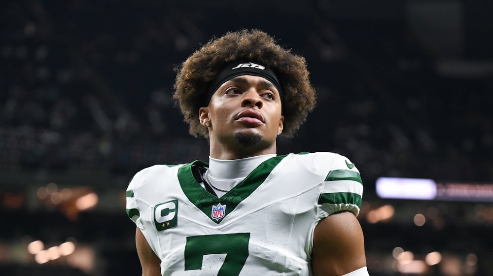 FILE - New York Jets quarterback Justin Fields warms up before an NFL football game against the New Orleans Saints on Dec. 21, 2025, in New Orleans. (AP Photo/Ella Hall, File)