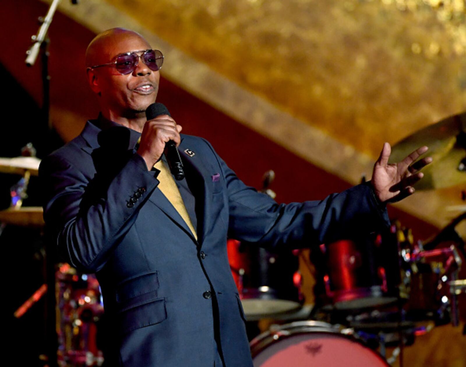 LOS ANGELES, CA - SEPTEMBER 25:  Dave Chappelle speaks onstage at Q85: A Musical Celebration for Quincy Jones at the Microsoft Theatre on September 25, 2018 in Los Angeles, California.  (Photo by Kevin Winter/Getty Images)