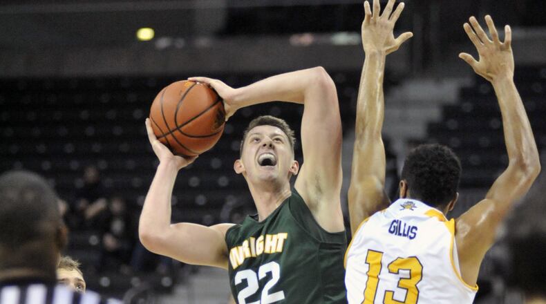 Wright State sophomore forward Parker Ernsthausen puts up a shot against Northern Kentucky sophomore forward Brennan Gillis last season at BB&T Arena. Jay Morrison/Staff