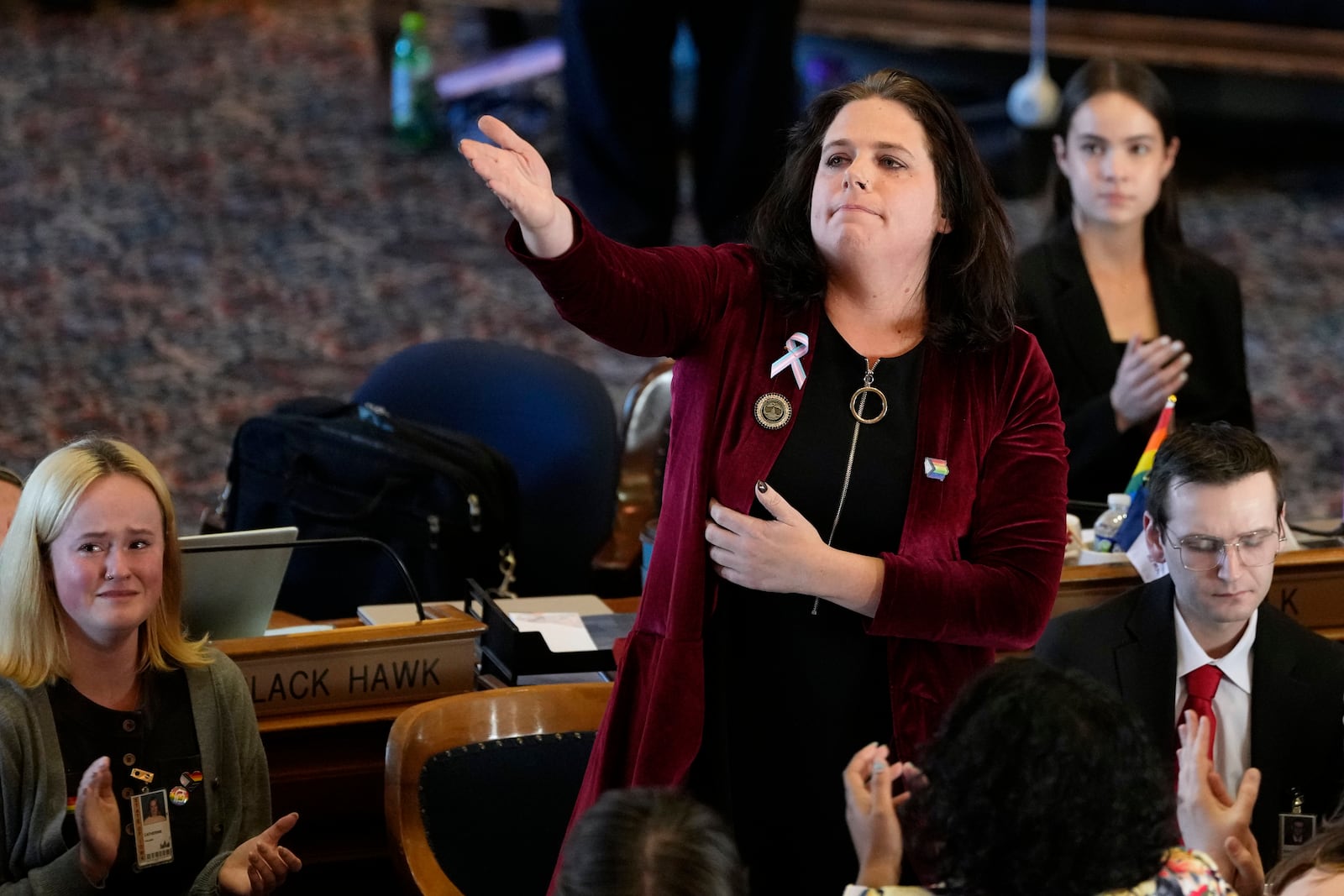 FILE - Rep. Aime Wichtendahl, D-Hiawatha, reacts to the gallery after speaking during debate on the gender identity bill, Feb. 27, 2025, at the Statehouse in Des Moines, Iowa. (AP Photo/Charlie Neibergall, File)