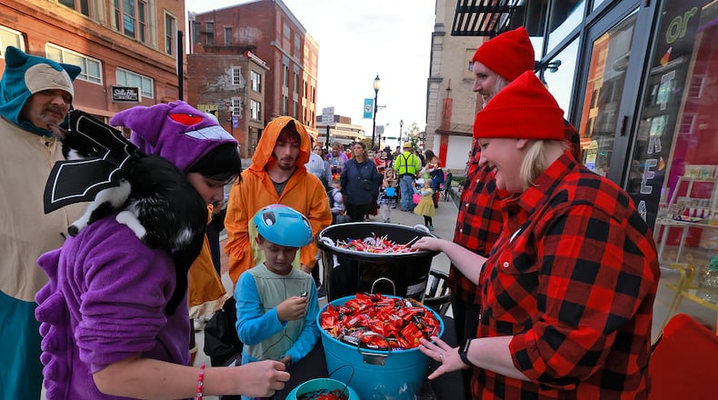 Hundreds of creepy and cute characters filled the sidewalks and streets in downtown Springfield for the seventh annual Downtown Springfield Trick or Treat Friday, Oct. 25, 2024. Downtown merchants, community organizations and nonprofits passed out candy, Halloween characters roamed the sidewalks and danced in the street. BILL LACKEY/STAFF