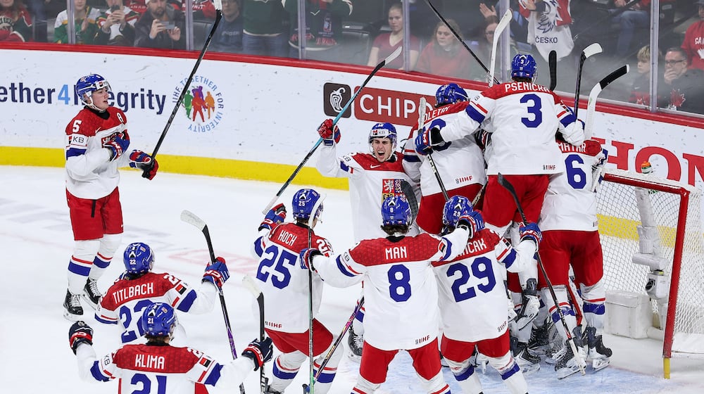 Czechia players celebrate their teams win during the third period of an IIHF World Junior Hockey Championship semifinals game against Canada, Sunday, Jan. 4, 2026, in St. Paul, Minn. (AP Photo/Matt Krohn)