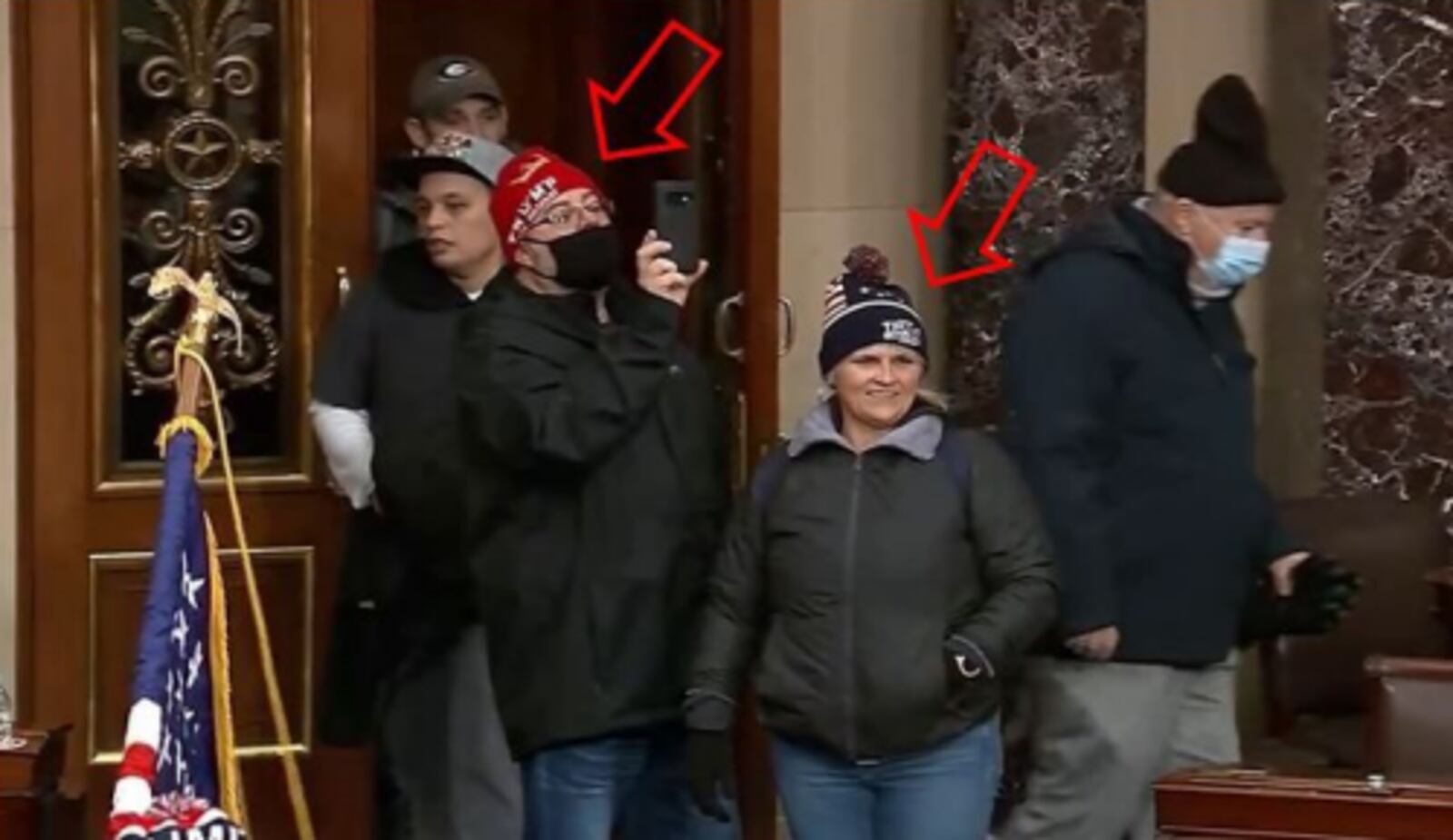 Shawndale Chilcoat (black beanie) and Donald Chilcoat (red beanie), shown in Capitol building security footage entering the Senate chambers. The photo was included in a federal criminal complaint filed with the U.S. District Court for the District of Columbia.