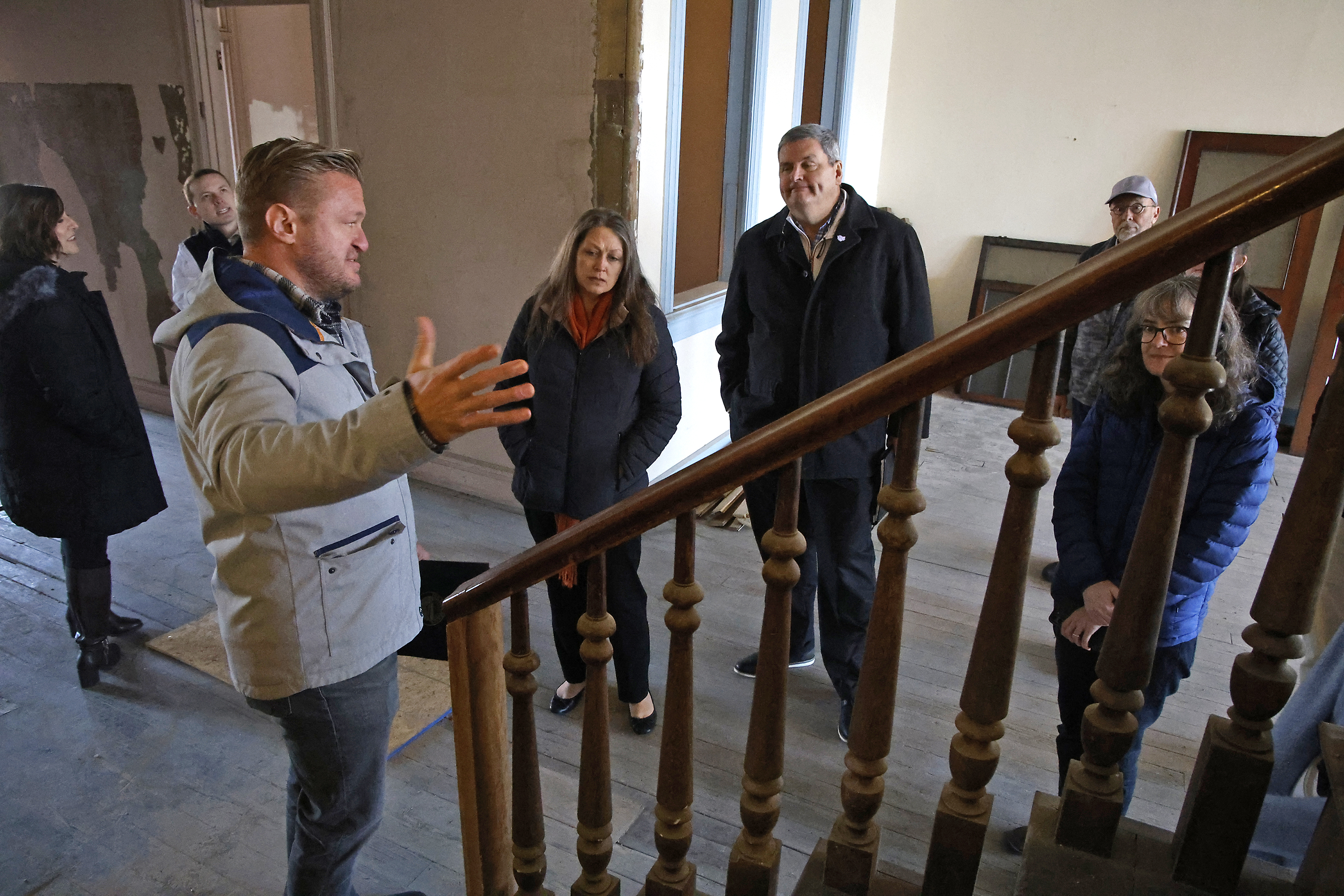 Jamon Sellman, the owner of the Willman Building in downtown Urbana, gives a tour of the second floor of the building Friday, Dec. 8, 2023 following a groundbreaking event for the redevelopment of the former furniture store into a Willwork Coworking space and living space. BILL LACKEY/STAFF