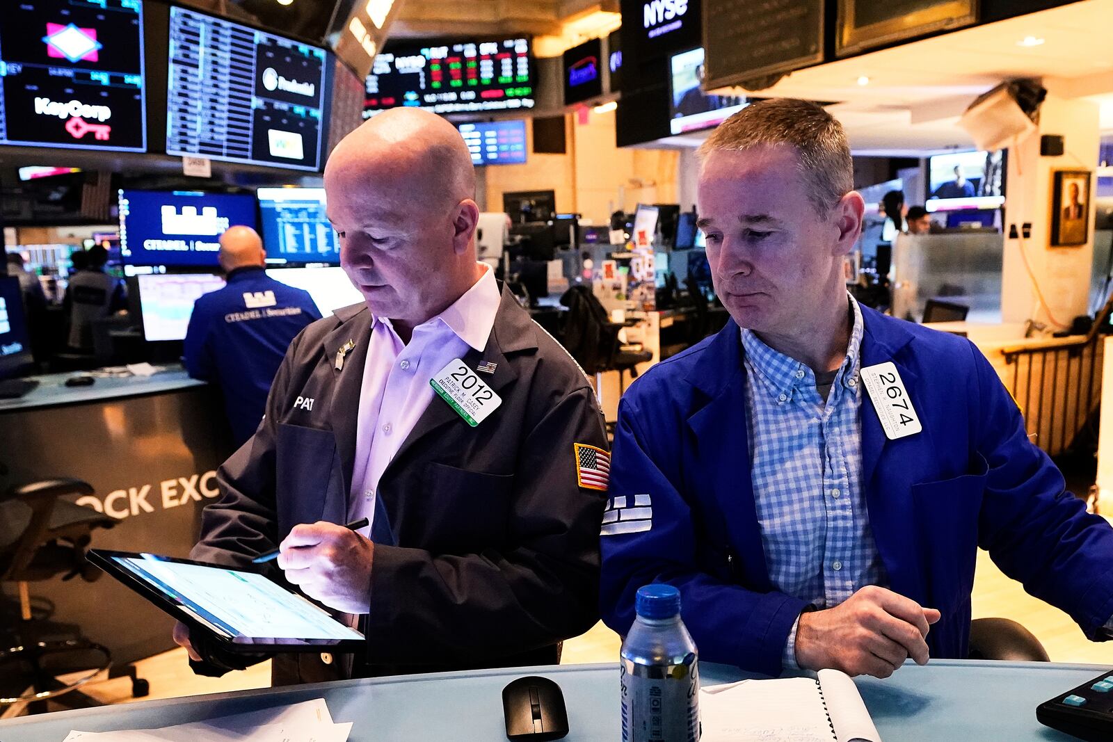 Trader Patrick Casey, left, and specialist Stephen Naughton work on the floor of the New York Stock Exchange, Friday, April 25, 2025. (AP Photo/Richard Drew)