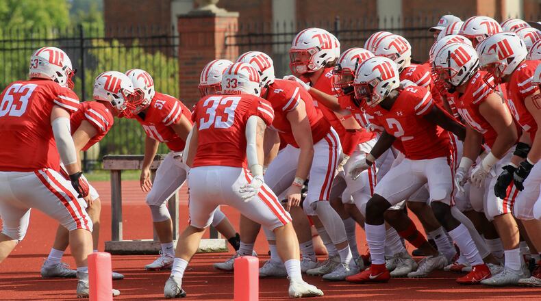 Wittenberg players prepare to run onto the field before a game against Hiram on Saturday, Sept. 18, 2021, at Edwards-Maurer Field in Springfield. David Jablonski/Staff