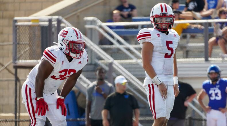 Wittenberg quarterback Max Milton, right, and running back Bryce Anderson line up for a play against Dubuque on Saturday, Sept. 2, 2023, in Iowa. Photo courtesy of Wittenberg University