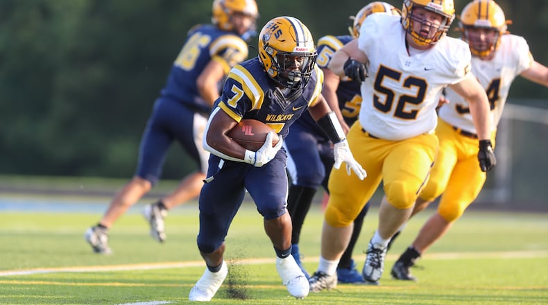 Cutline: Springfield High School senior Jayvin Norman carries the ball during their game against Cleveland St. Ignatius on Friday, Aug. 18 in Springfield. CONTRIBUTED PHOTO BY MICHAEL COOPER