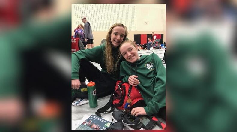 Twin sisters Bridget Engel (left) and Addie Engel represent Catholic Central at the Division II state swimming championships in Canton. Both qualified in the 100-yard breaststroke. Contributed