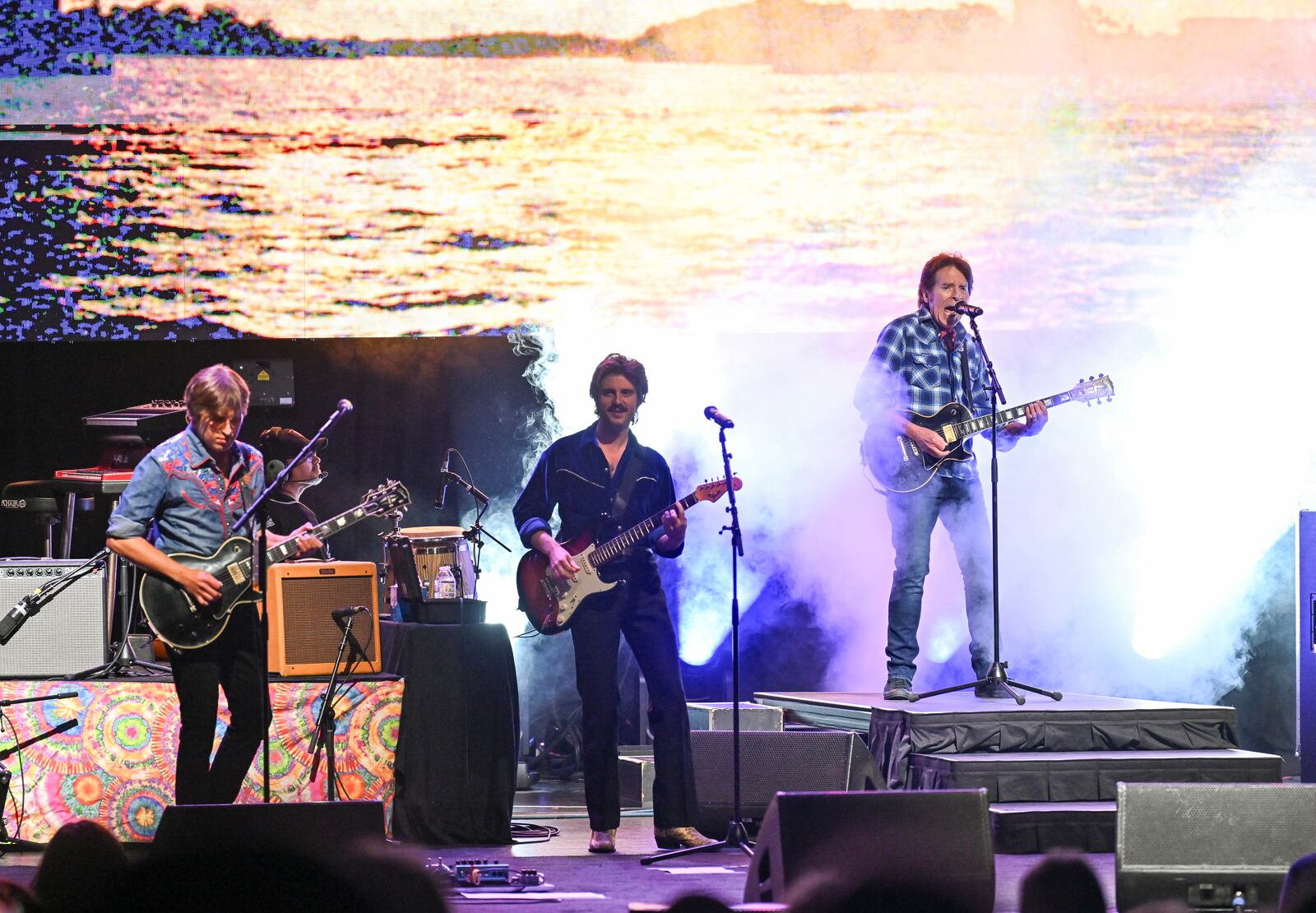 Musician John Fogerty, right, performs with his sons Shane Fogerty, far left, and Tyler Fogerty during his 80th birthday celebration concert at the Beacon Theatre on Thursday, May 29, 2025, in New York. (Photo by Evan Agostini/Invision/AP)