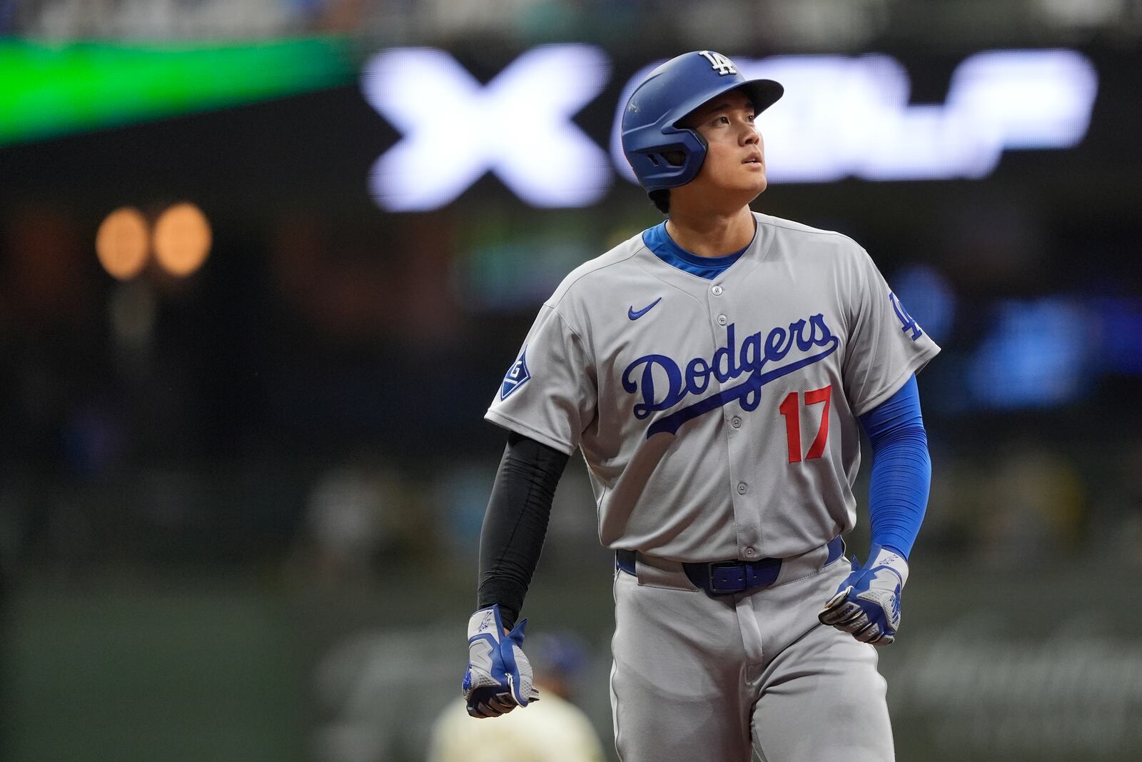 Los Angeles Dodgers' Shohei Ohtani looks on during the eighth inning of a baseball game against the Milwaukee Brewers, Monday, July 7, 2025, in Milwaukee. (AP Photo/Aaron Gash)