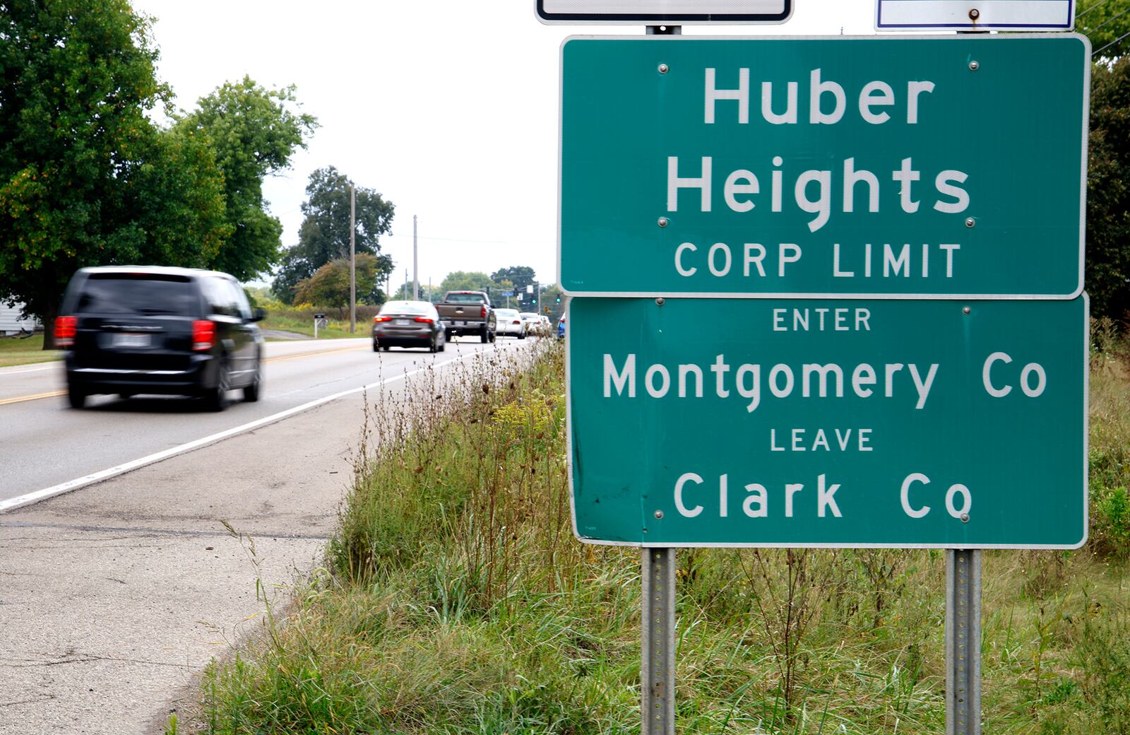 Cars past a sign marking the Huber Heights Corp. Limit along Ohio Route 235 north of Interstate 70 near where the future Buc-ee's will be located. BILL LACKEY/STAFF