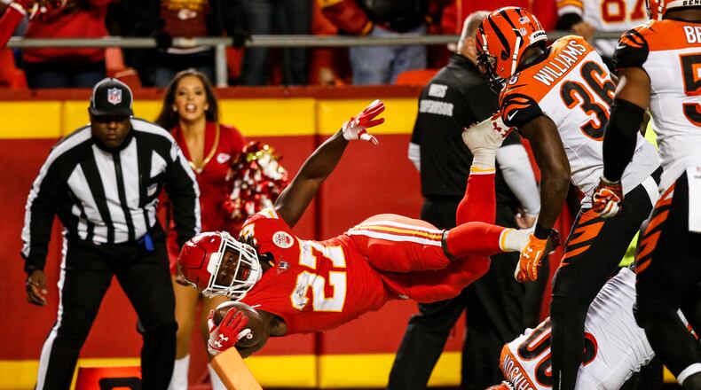 KANSAS CITY, MO - OCTOBER 21: Kareem Hunt #27 of the Kansas City Chiefs dives across the goal line for the second touchdown of the game during the second quarter of the game against the Cincinnati Bengals at Arrowhead Stadium on October 21, 2018 in Kansas City, Kansas. (Photo by David Eulitt/Getty Images)