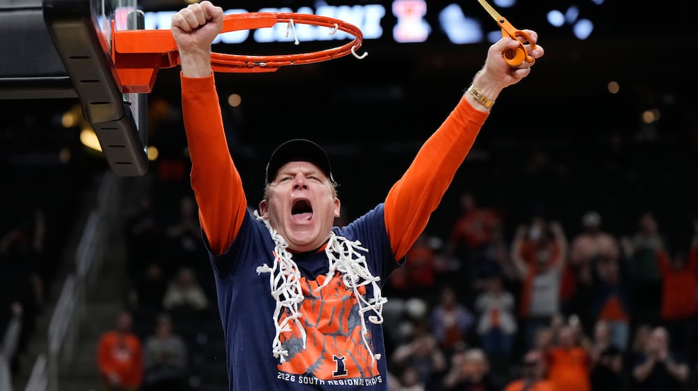 Illinois coach Brad Underwood celebrates after Illinois beat Iowa in an Elite Eight game in the NCAA college basketball tournament Saturday, March 28, 2026, in Houston. (AP Photo/Ashley Landis)