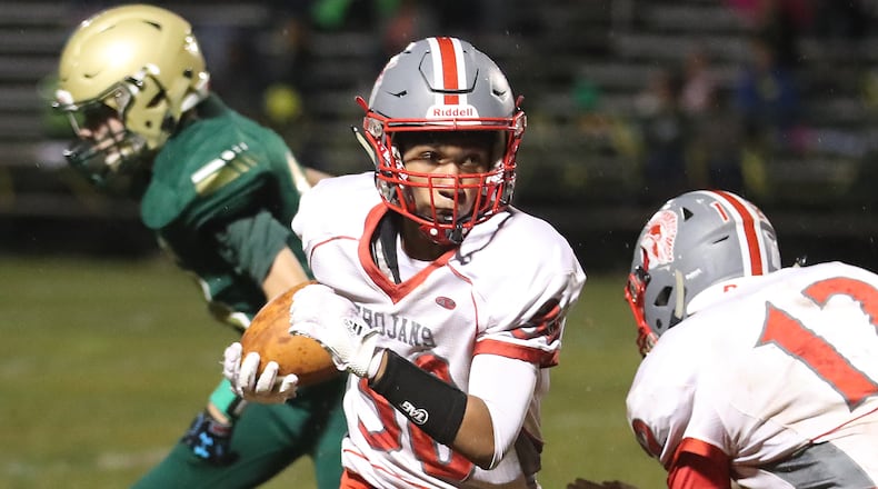 Southeastern’s Mason Coil carries the ball against Catholic Central. BILL LACKEY/STAFF