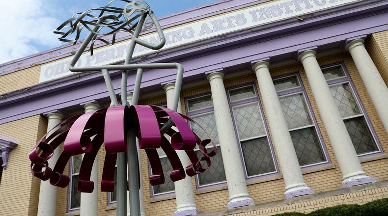 Marie McConnaughey’s welded art sculpture depicting an abstract ballerina in front of the Ohio Performing Arts Institute on East High Street. BILL LACKEY/STAFF