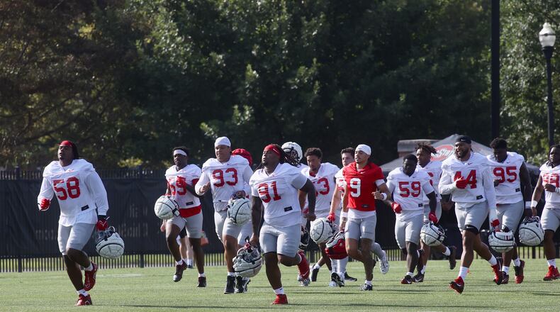 Players run to a drill at the first Ohio State football practice of the season on Thursday, Aug. 1, 2024, at the Woody Hayes Athletic Center in Columbus. David Jablonski/Staff