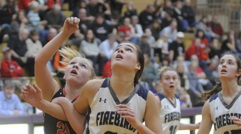 Tecumseh Macy Berner (left) and Fairmont’s Madeline Westbeld position for a rebound. Tecumseh defeated Fairmont 54-45 in a girls high school basketball D-I sectional semifinal at Vandalia-Butler last season. MARC PENDLETON / STAFF