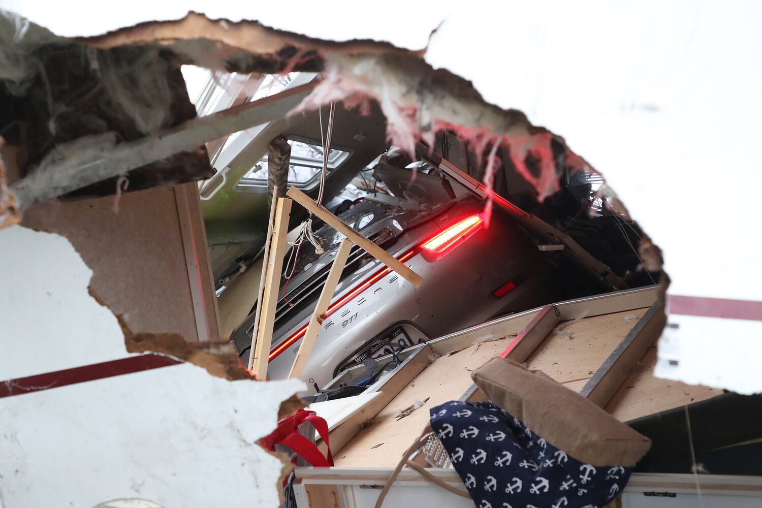 PHOTOS: Porsche Crashes Through Camper