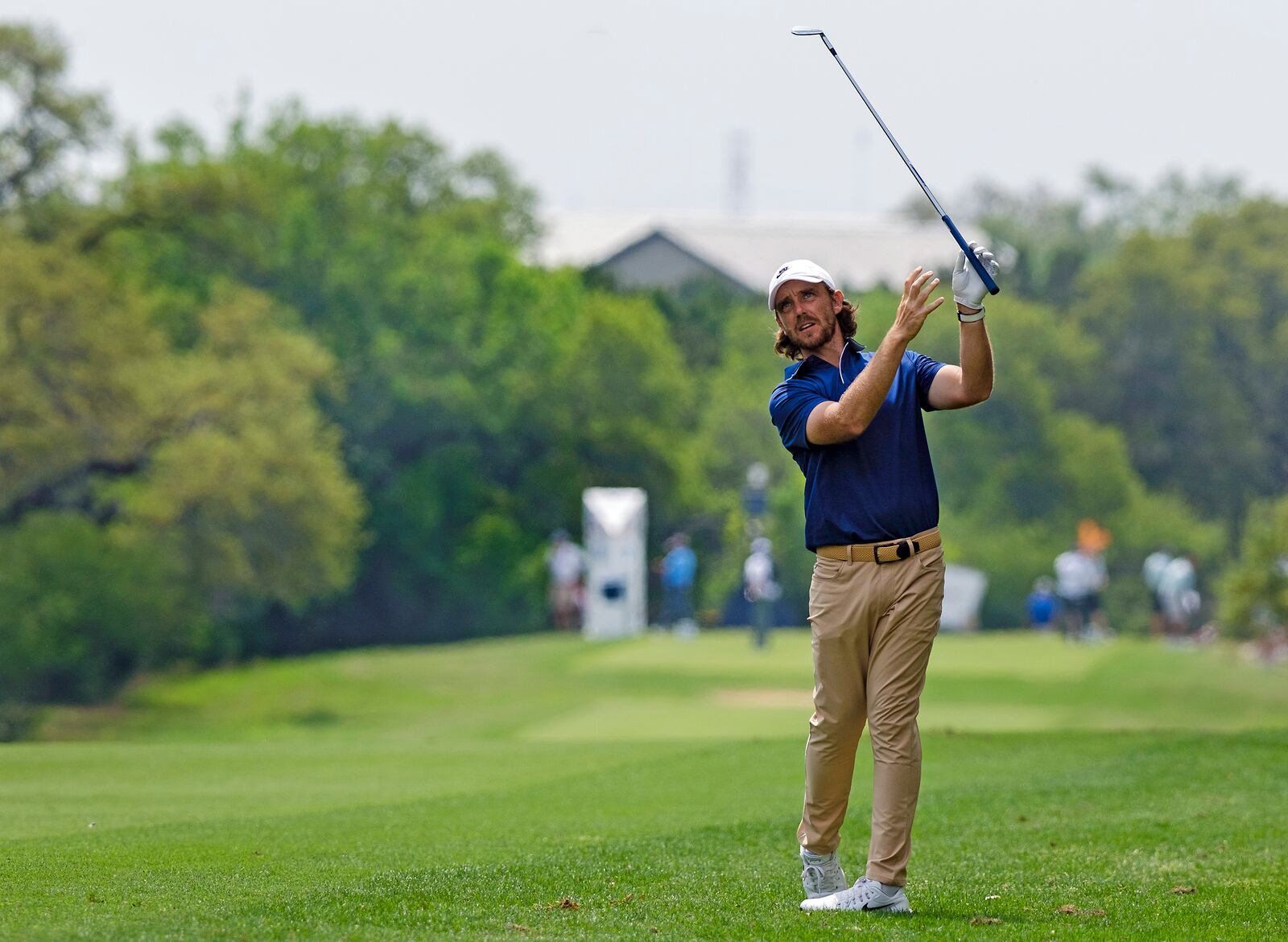 Tommy Fleetwood, of England, reacts to hits his approach shot from the ninth fairway during the first round of the Texas Open golf tournament, Thursday, April 3, 2025, in San Antonio, Texas. (AP Photos/Rodolfo Gonzalez)