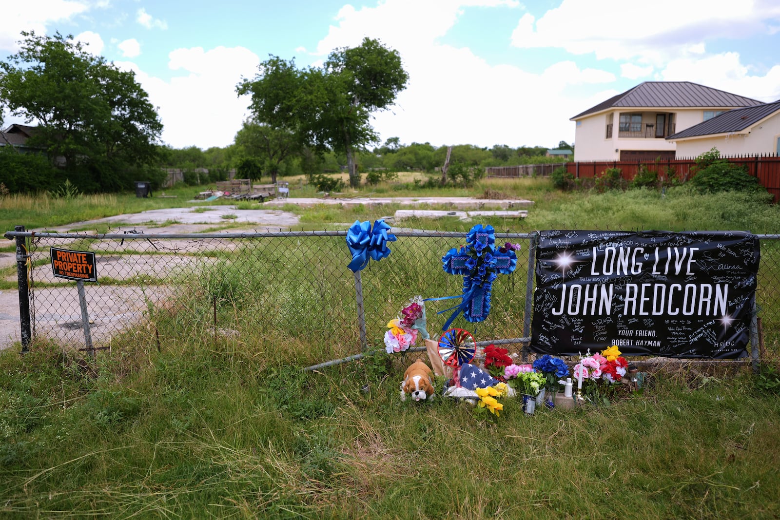 Candles, flowers, and notes are placed at a makeshift memorial in San Antonio, on Thursday, June 5, 2025, for voice actor Jonathan Joss who was recently killed. (AP Photo/Eric Gay)
