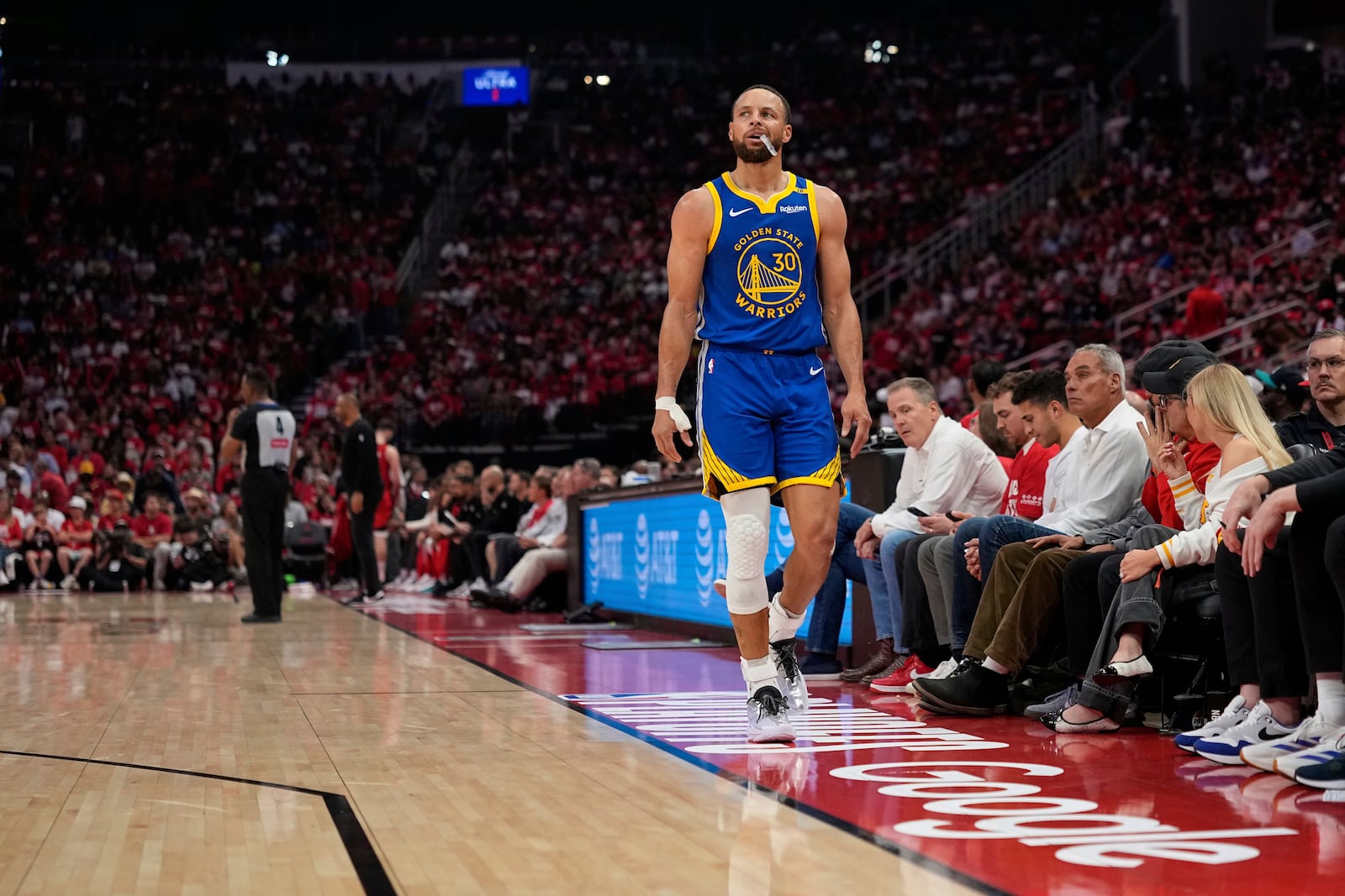 Golden State Warriors guard Stephen Curry (30) watches from the sidelines during the first half of Game 5 of an NBA basketball first-round playoff series against the Houston Rockets, Wednesday, April 30, 2025, in Houston. (AP Photo/David J. Phillip)