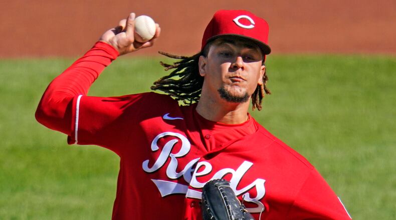 Cincinnati Reds starting pitcher Luis Castillo delivers during the first inning of the team's baseball game against the Pittsburgh Pirates in Pittsburgh, Friday, Sept. 4, 2020. (AP Photo/Gene J. Puskar)