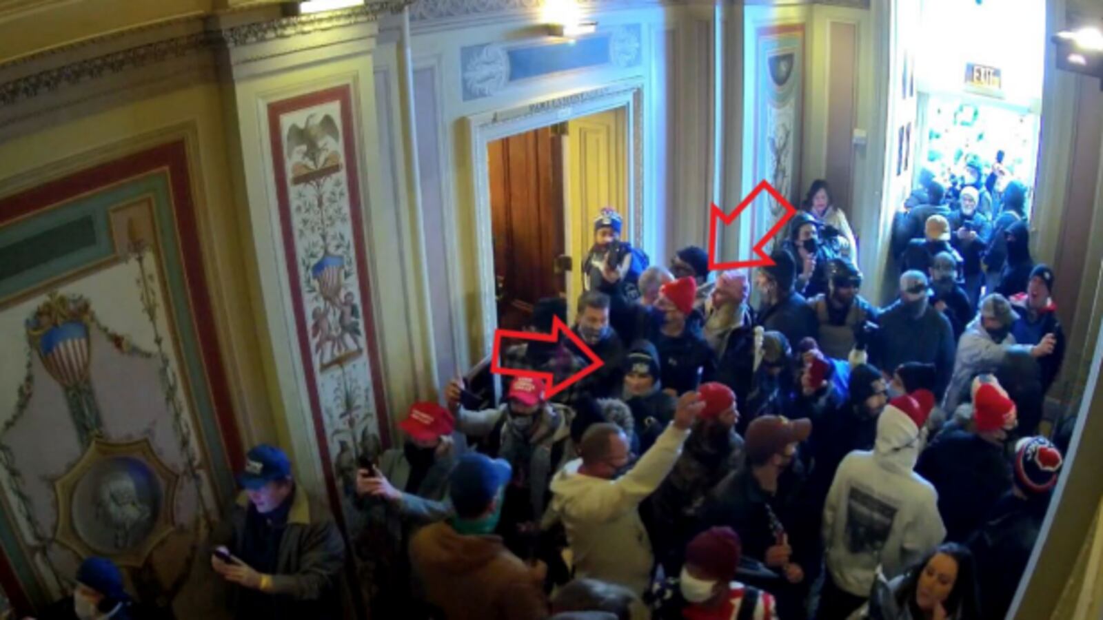 Shawndale Chilcoat (black beanie) and Donald Chilcoat (red beanie), shown in Capitol building security footage entering the building with the crowd. The photo was included in a federal criminal complaint filed with the U.S. District Court for the District of Columbia.