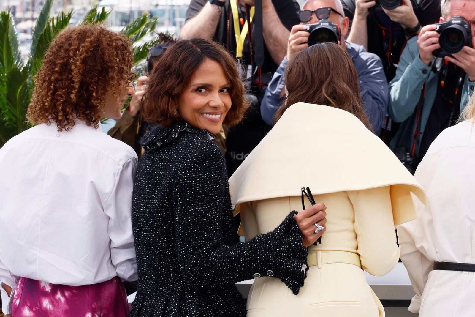Jury members Leila Slimani, left, and Halle Berry, pose with jury president Juliette Binoche at the jury photo call at the 78th international film festival, Cannes, southern France, Tuesday, May 13, 2025. (Photo by Joel C Ryan/Invision/AP)