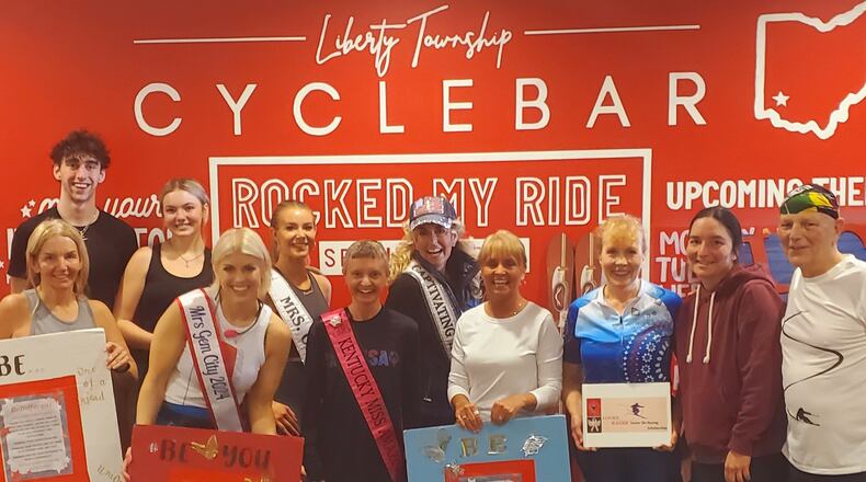 CycleBar hosted a cycling charity fundraiser with dozens of participants pedaling away on stationary bikes so youth snow skiers and special needs adults can afford to hit the slopes. “Lucky Racer” founder and director Kris Scherer is pictured center back row. CONTRIBUTED