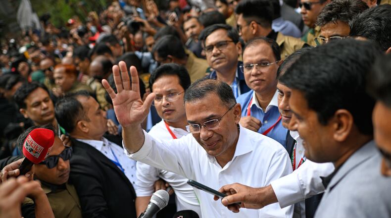 Bangladesh Nationalist Party Chairperson Tarique Rahman waves as he comes out after casting his vote during the national parliamentary elections in Dhaka, Bangladesh, Thursday, Feb. 12, 2026. (AP Photo/Mahmud Hossain Opu)