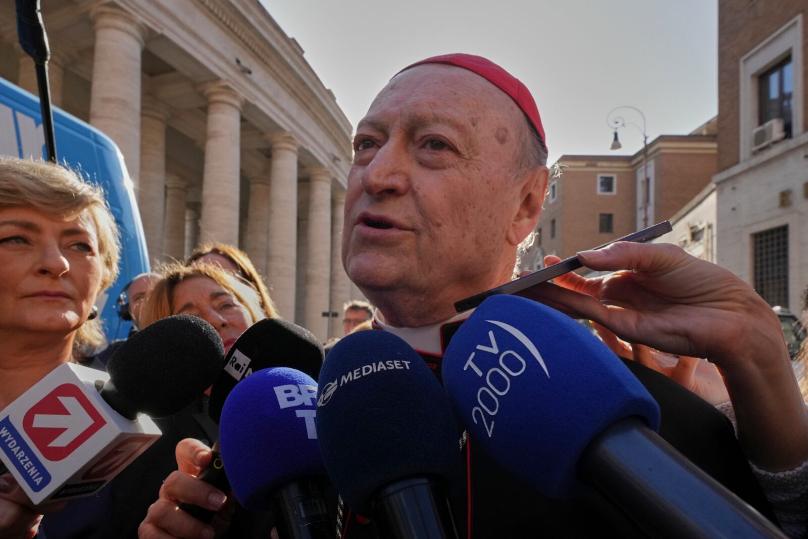Cardinal Gianfranco Ravasi speaks to journalists as he arrives for a meeting of cardinals at the Vatican, Tuesday, April 22, 2025. (AP Photo/Andrew Medichini)