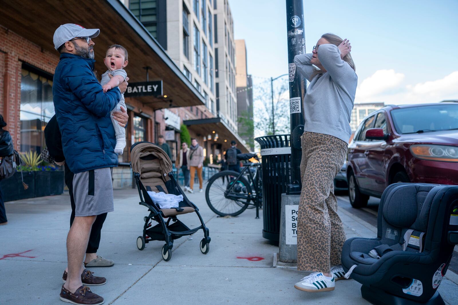 Elizabeth Mahon, owner of the baby store Three Littles, prepared to install a new car seat for a customer who made the purchase ahead of tarriff-driven price increases, at the Union Market location in Washington, on Wednesday, April 16, 2025. (AP Photo/Nathan Howard)