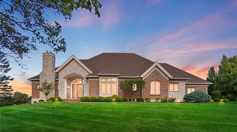 Built in 2004, this Beavercreek Township brick ranch has three, possibly four bedrooms and overlooks the 16th hole at Country Club of the North golf course. CONTRIBUTED