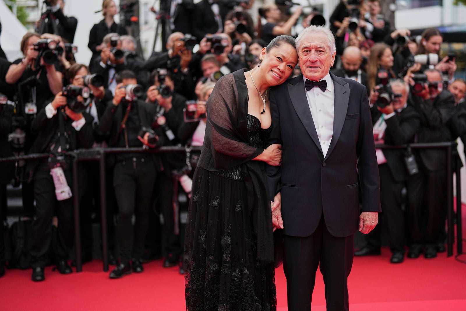 Tiffany Chen, left, and Robert De Niro pose for photographers during the opening ceremony red carpet of the 78th international film festival, Cannes, southern France, Tuesday, May 13, 2025. (Photo by Scott A Garfitt/Invision/AP)