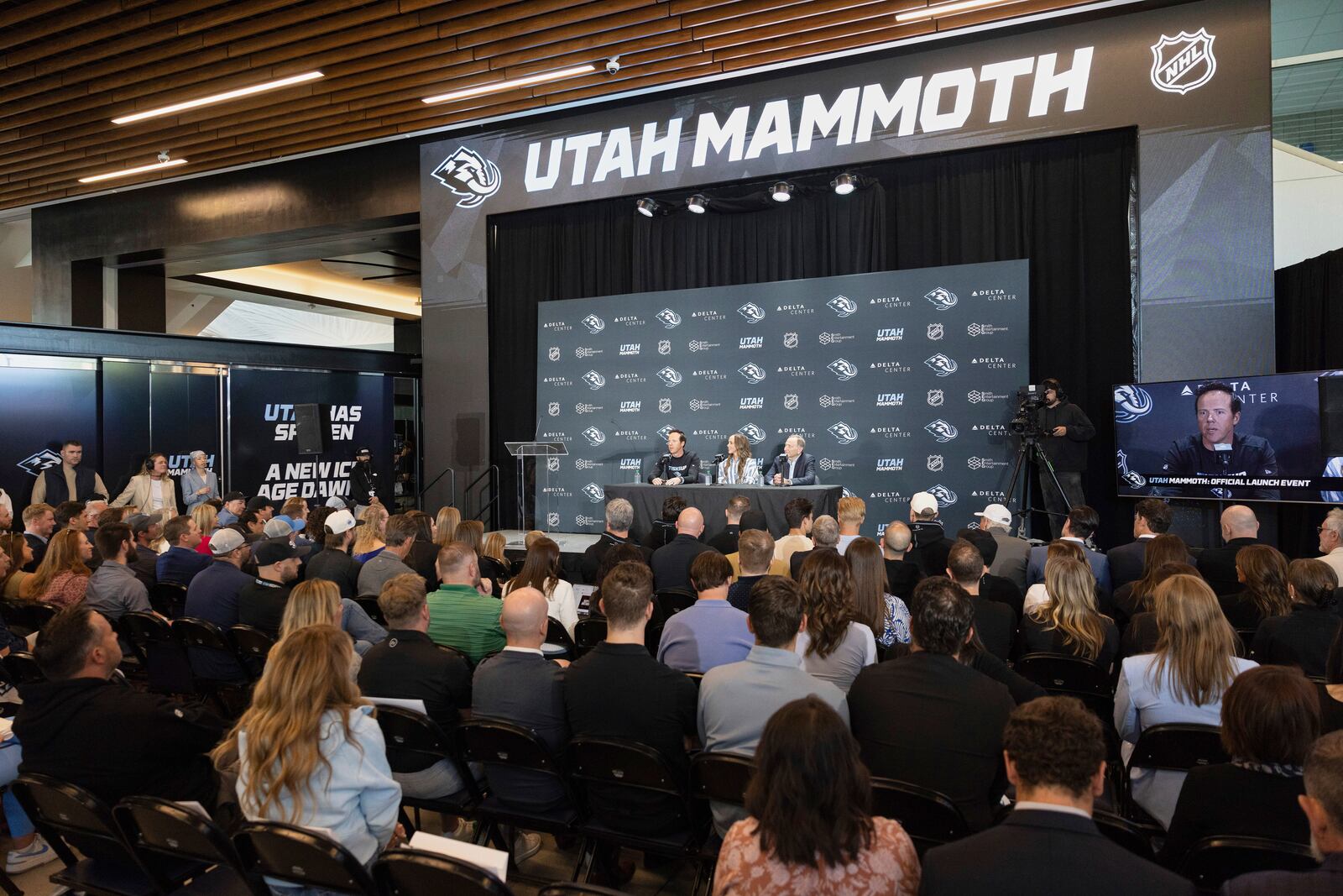 Chairman of Smith Entertainment Group Ryan Smith and co-founder Ashley Smith join NHL Commissioner Gary Bettman, from left, as they announce the Utah Mammoth as the new name and branding identity of Utah's NHL franchise, Wednesday, May 7, 2025, in Salt Lake City. (AP Photo/Melissa Majchrzak)