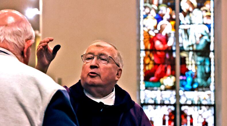 After 46 years, Father John MacQuarrie will retire in June. He was ordained on June 17, 1978, and has served churches throughout the area, including in Cincinnati, Dayton, West Milton and Springfield.
His return to Clark County also marked a quick reconnection with Springfield, and in 2014 a new church assignment at St. Bernard Catholic Church, where he has been pastor for the last 10years. He also provides service to the St. Theresa, St. Raphael and St. Joseph parishes in Springfield, as well as that of St. Charles in South Charleston. BILL LACKEY/STAFF