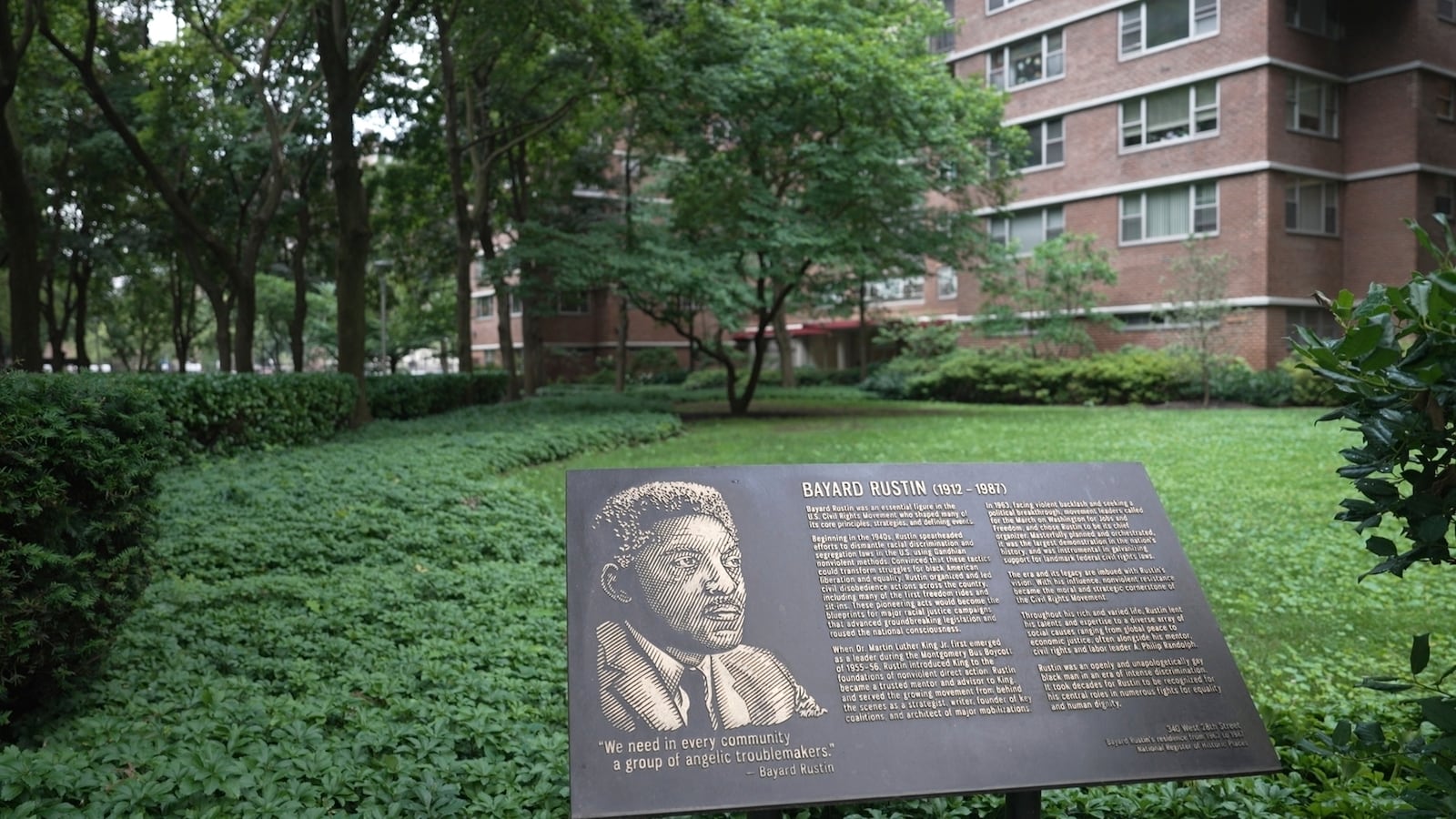 In this still image taken from video, a plaque honoring Bayard Rustin is pictured outside of partner Walter Naegle's home on Saturday, June 28, 2025, in New York. (AP Photo/Mary Conlon)