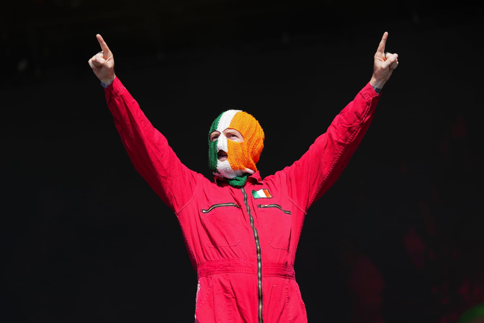 J. J. O Dochartaigh from the hip hop trio Kneecap performs during the Glastonbury Festival in Worthy Farm, Somerset, England, Saturday, June 28, 2025. (Scott A Garfitt/Invision/AP)