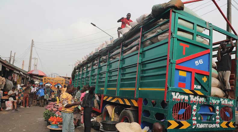 FILE -Workers offload grains from a truck at the Mile 12 Market in Lagos, Nigeria, Feb. 16, 2024. AP Photo/Mansur Ibrahim, File)