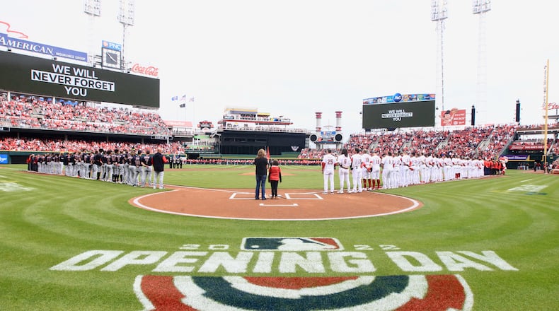 The Reds and Guardians stand for the national anthem on Opening Day on Tuesday, April 12, 2022, at Great American Ball Park in Cincinnati. David Jablonski/Staff