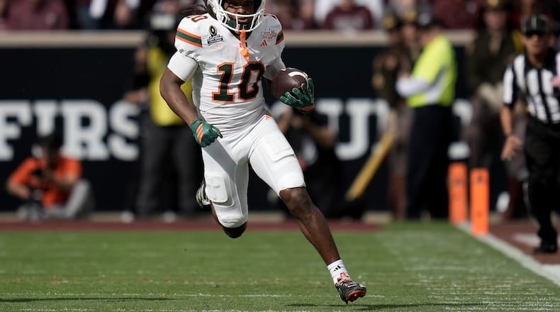 Miami wide receiver Malachi Toney (10) returns a punt against Texas A&M during the second quarter in the first round of the College Football Playoff Saturday, Dec. 20, 2025, in College Station, Texas. (AP Photo/Sam Craft)