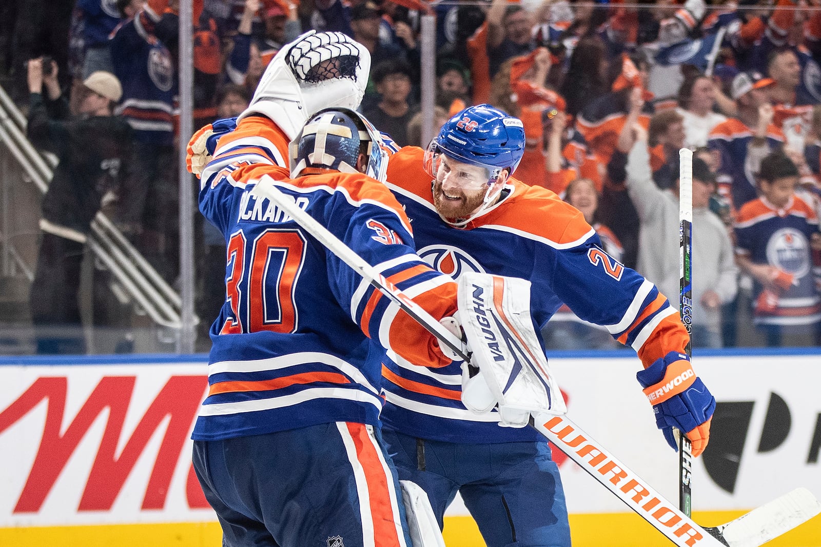 Edmonton Oilers goalie Calvin Pickard (30) and Connor Brown (28) celebrate the win over the Los Angeles Kings during NHL playoff action in Edmonton on Thursday, May 1, 2025. (Jason Franson/The Canadian Press via AP)